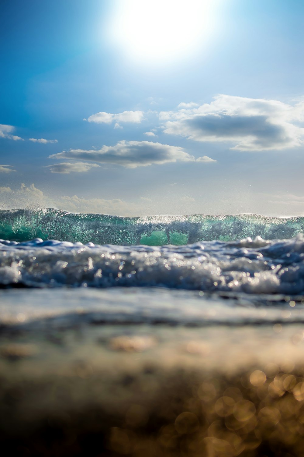 sea waves under clear blue sky