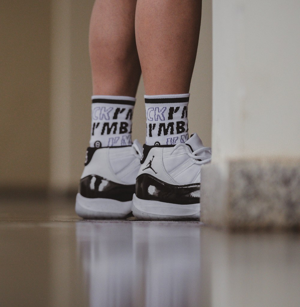 person wears Concord Air Jordan 11 shoes