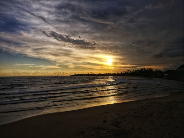 A beautiful sunset over a tranquil beach.
