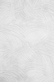 A white surface with a textured pattern created by curved, raised lines. The lines form a repetitive, wave-like design across the entire surface, giving it a three-dimensional appearance.