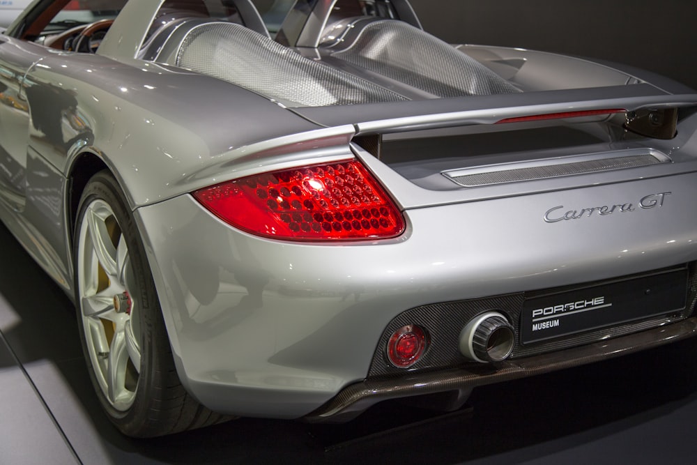 gray Porsche Carrera GT showing taillight photo – Free Red Image on Unsplash