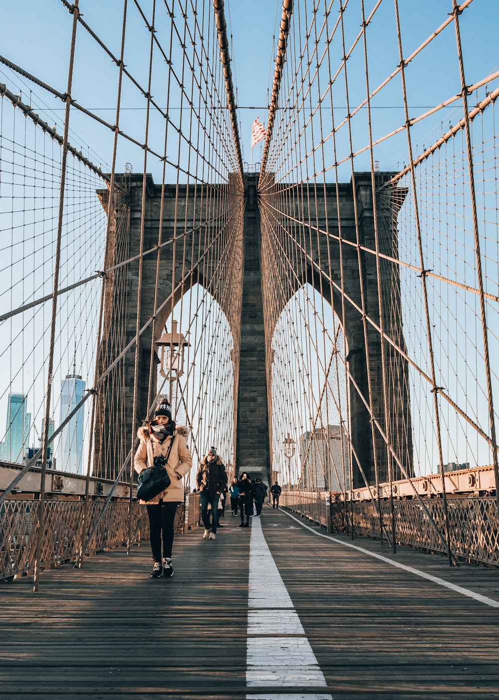 people walking on bridge during daytime