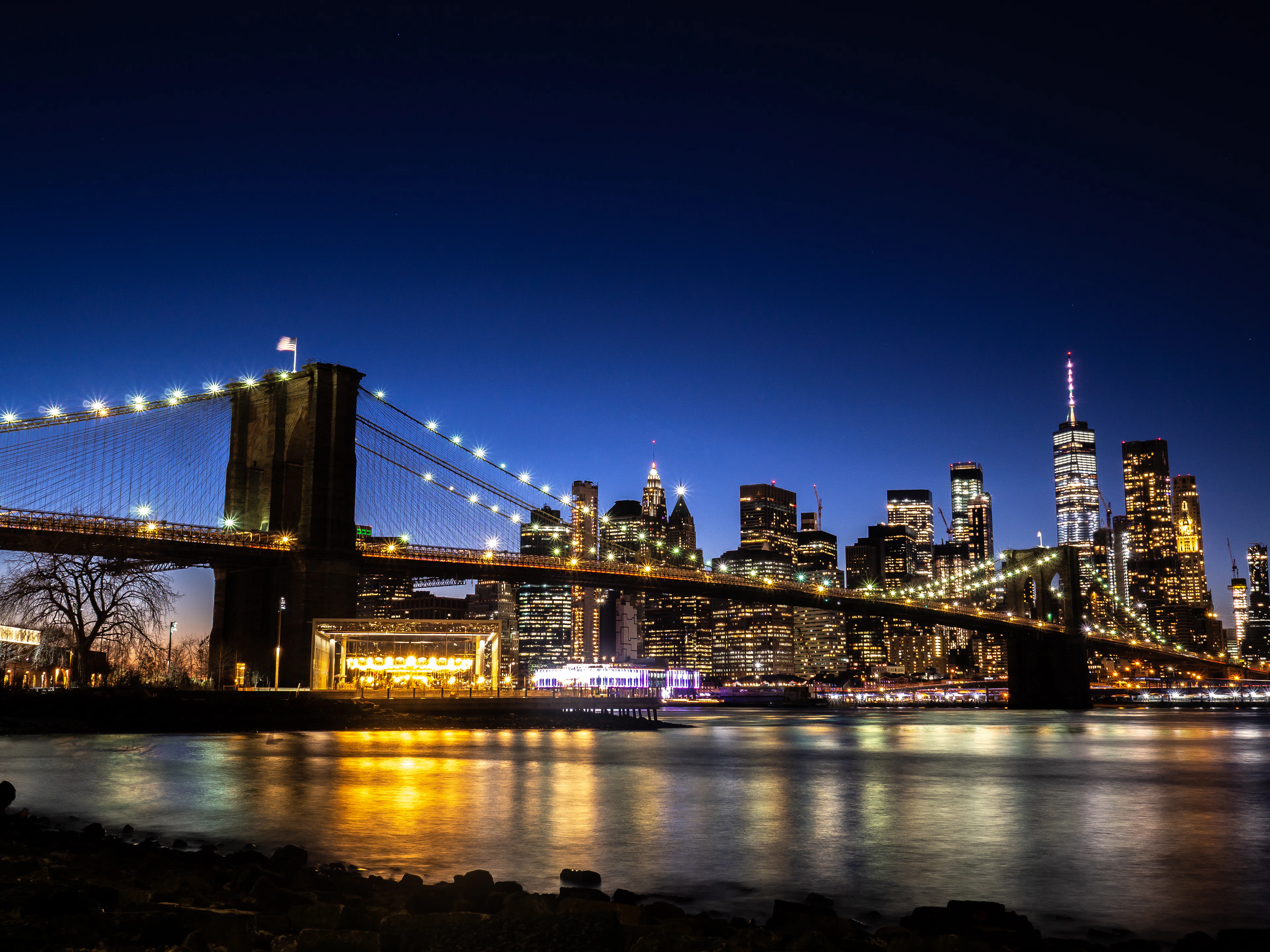 The Brooklyn Bridge lit against the Manhattan skyline, New York City