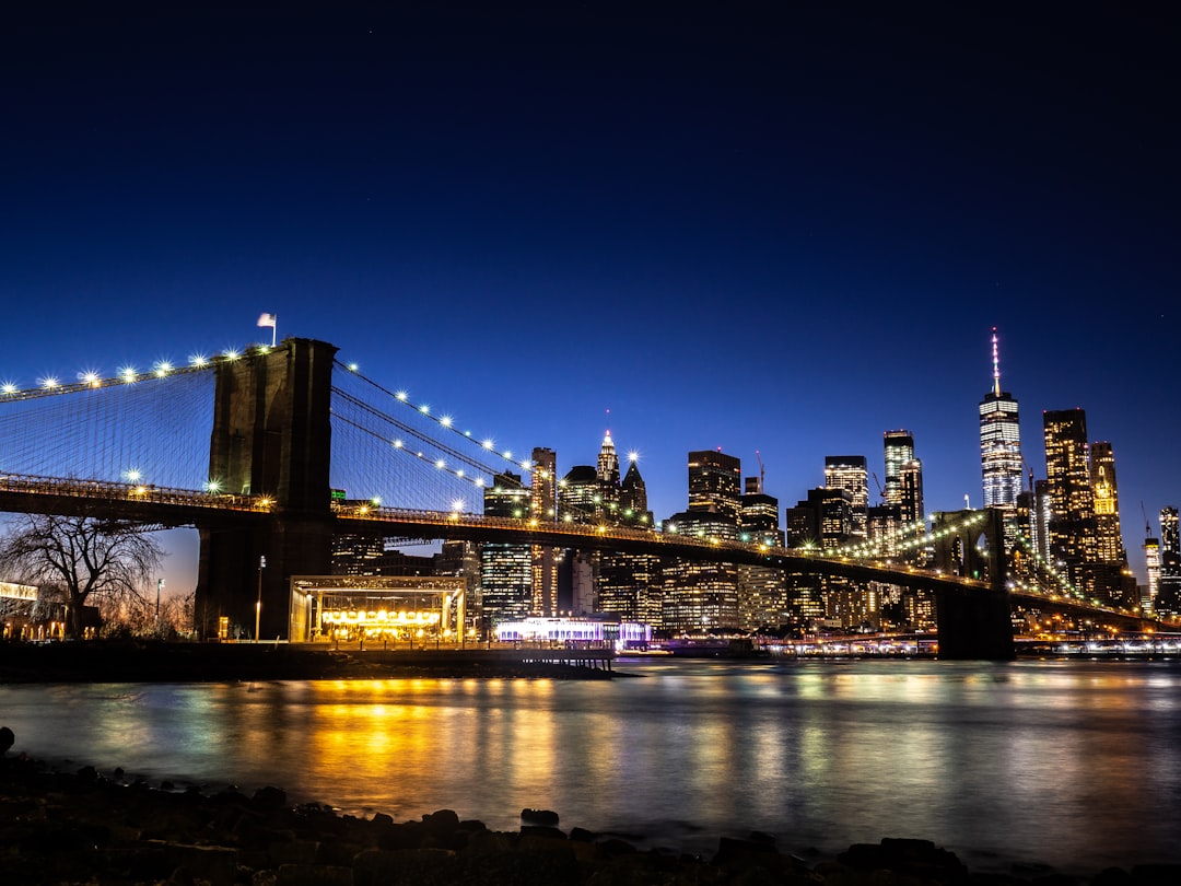 lighted brown concrete bridge,