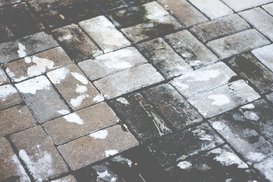Block-paved driveway before cleaning, sanding and sealing