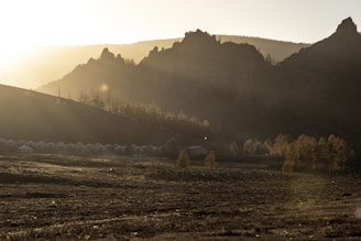 A serene landscape of Abim with a sunrise symbolizing hope and future growth.