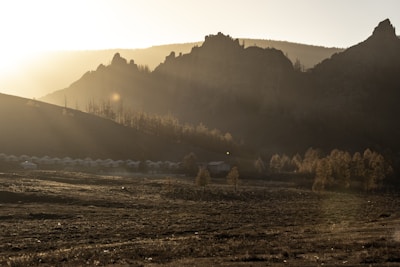 A serene landscape of Abim with a sunrise symbolizing hope and future growth.