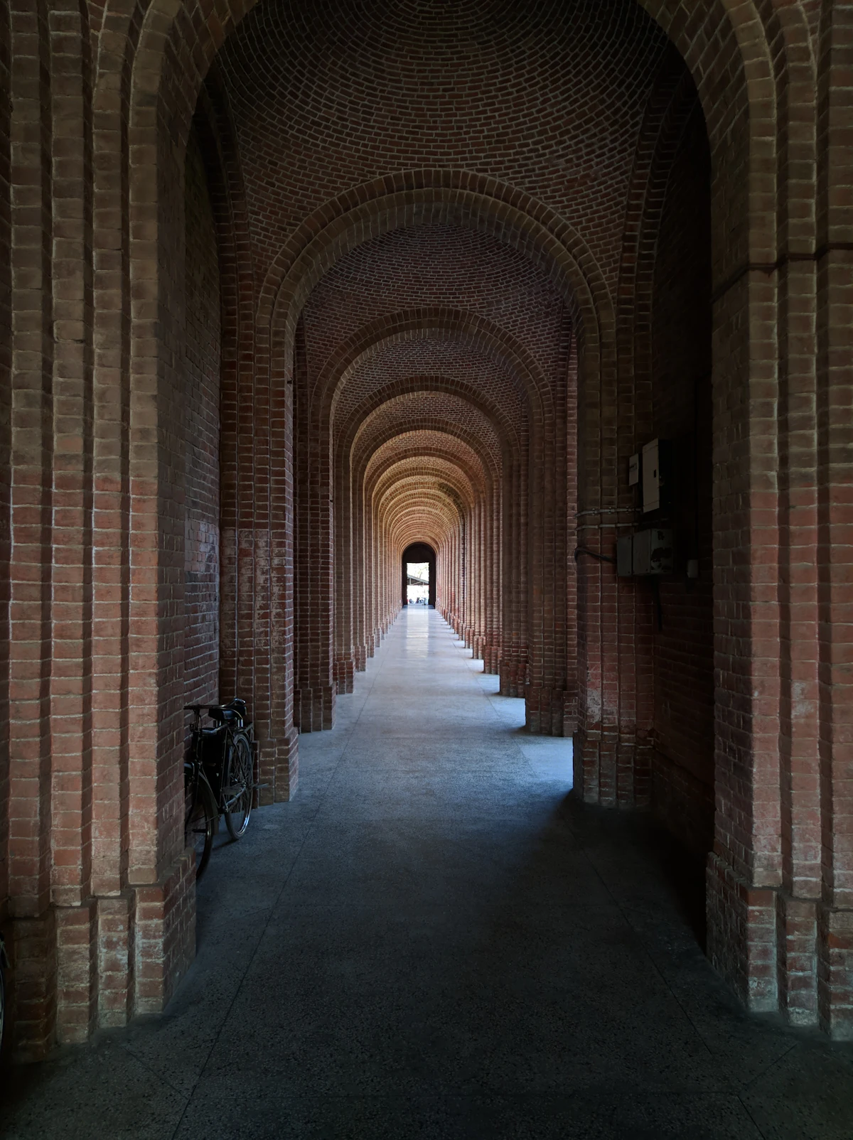 Colonial-era arched hallway at the Forest Research Institute campus, Dehradun