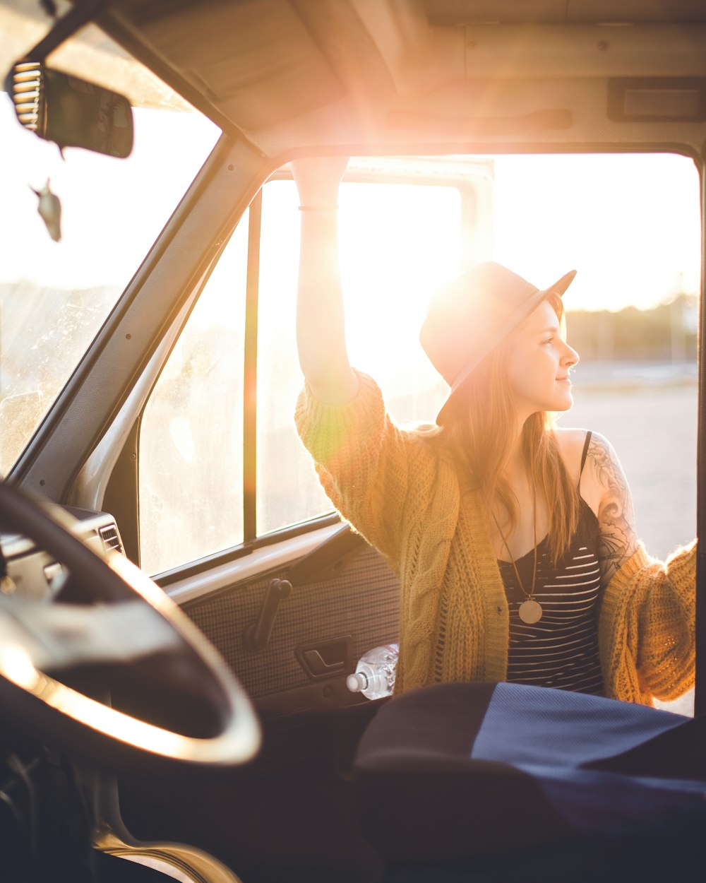 woman standing beside vehicle door