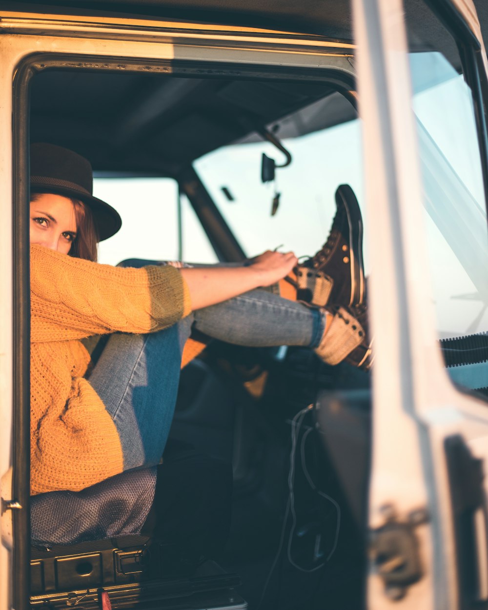 woman putting feet on compartment