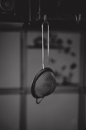 grayscale photography of colander