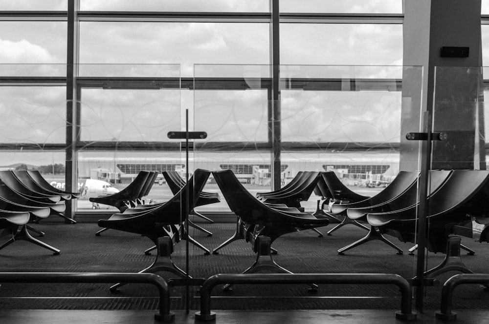 grayscale photography of empty chairs