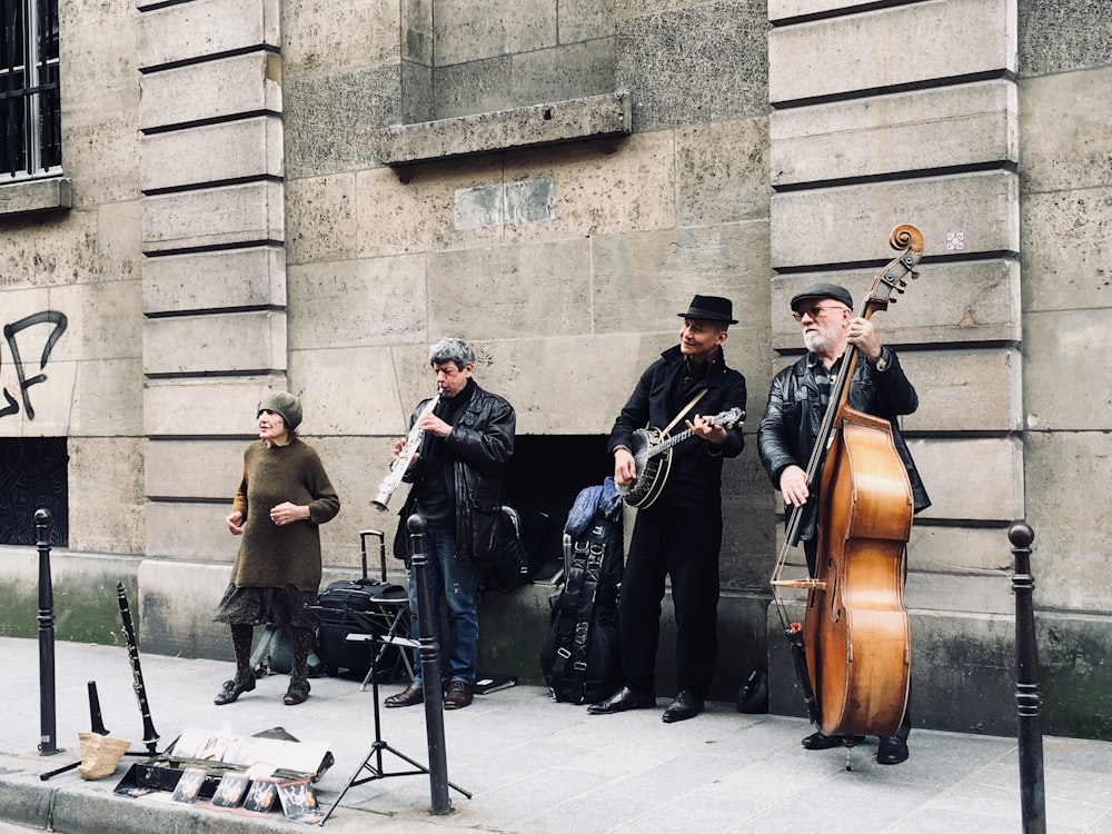 four men playing instruments