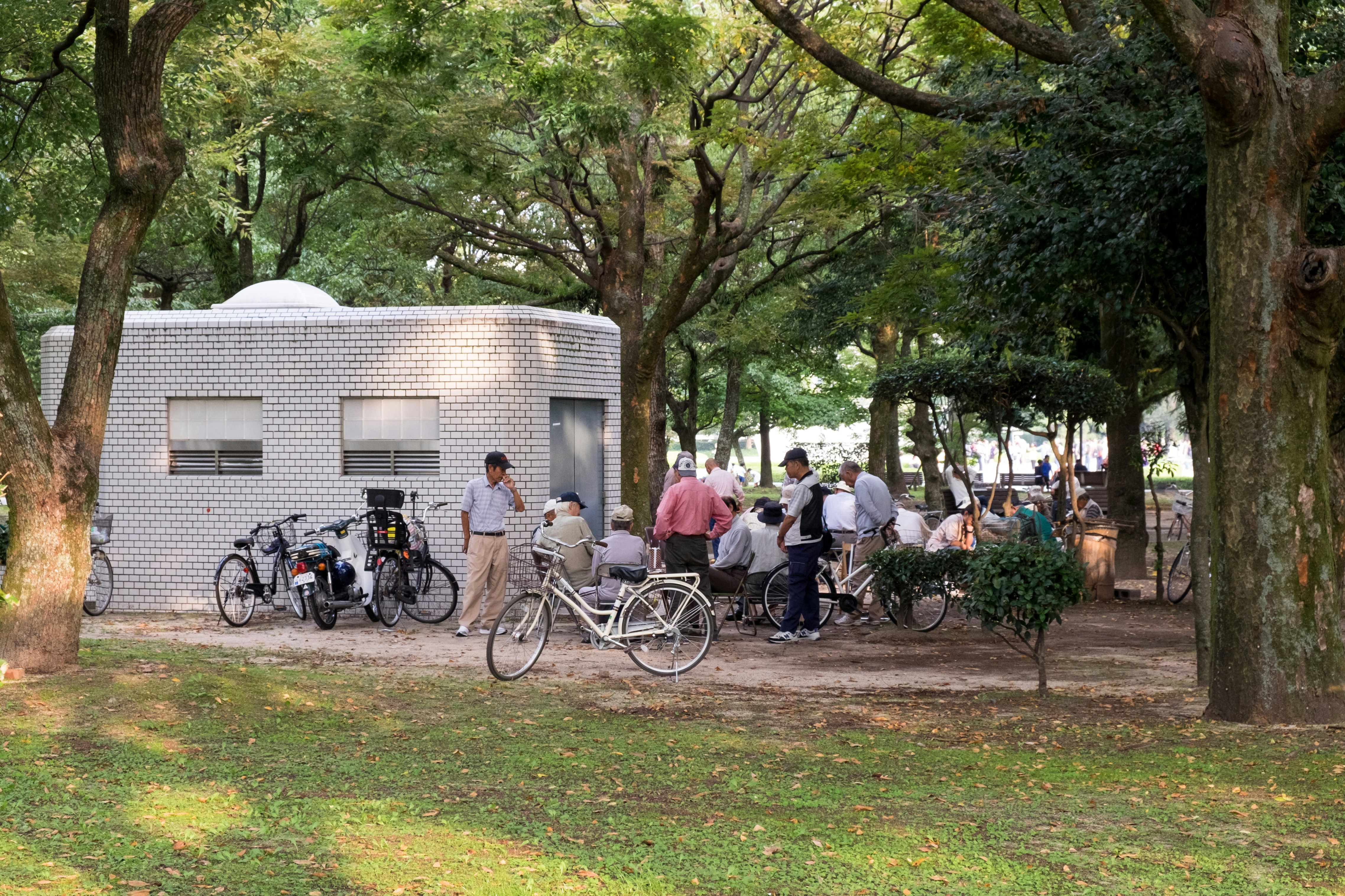 man standing beside house