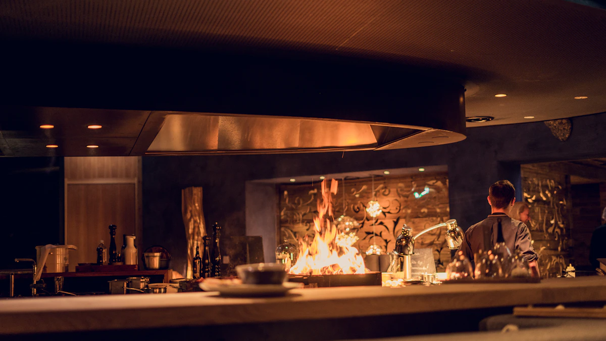 A chef working in an open restaurant kitchen
