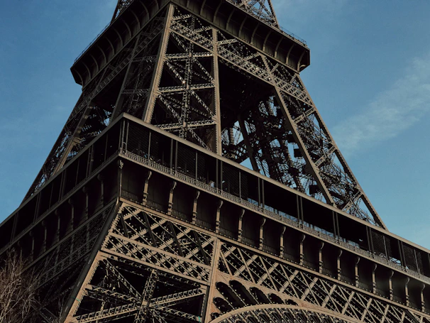 Close-up of the intricate architecture on the Cairo Tower against a clear blue sky.