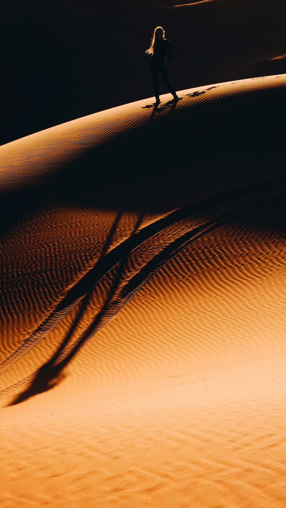 woman walking on desert
