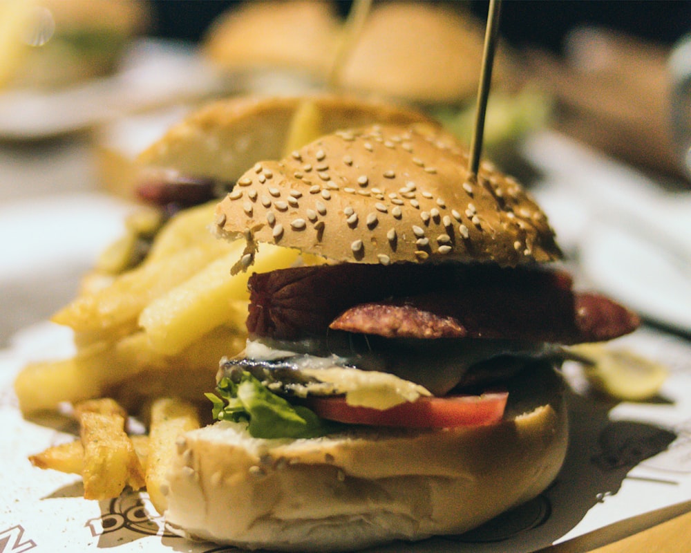 hamburgers with bites on white tray