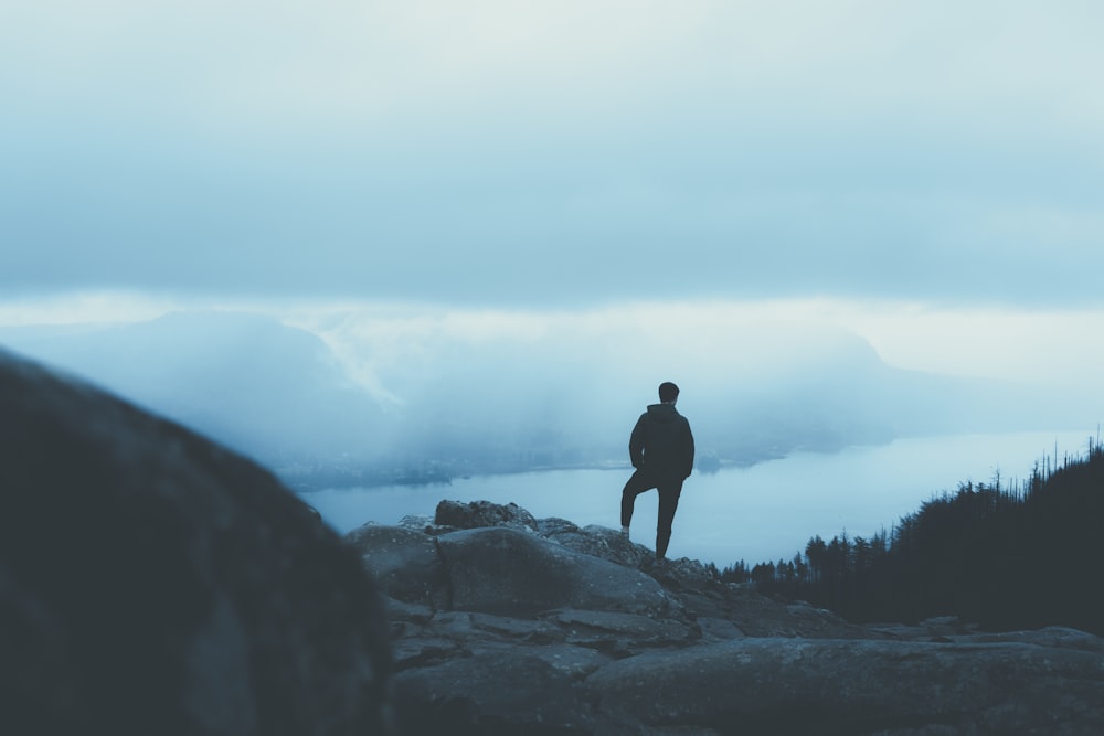 person standing on mountain