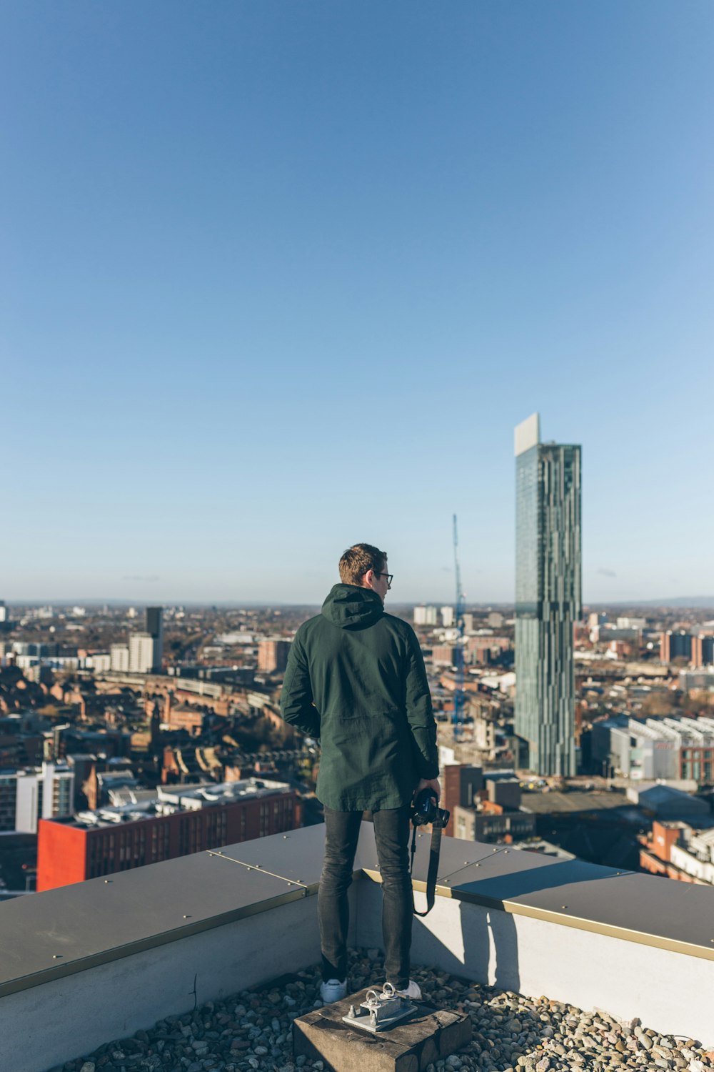 man weairng green hoodie