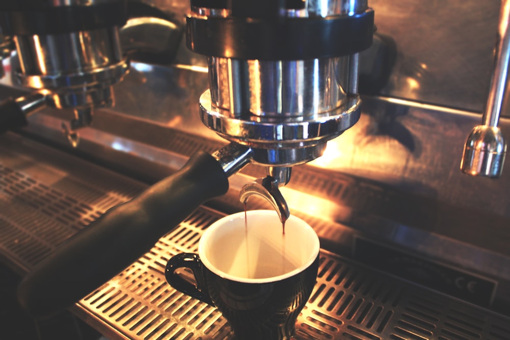 black mug on coffee maker