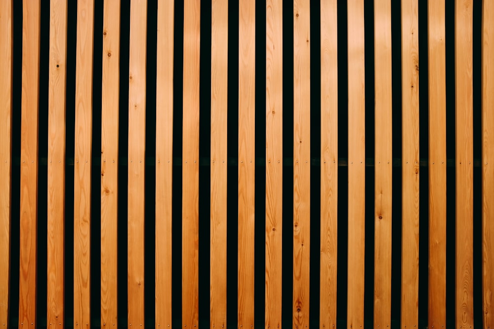 a close up of a wooden wall with vertical lines