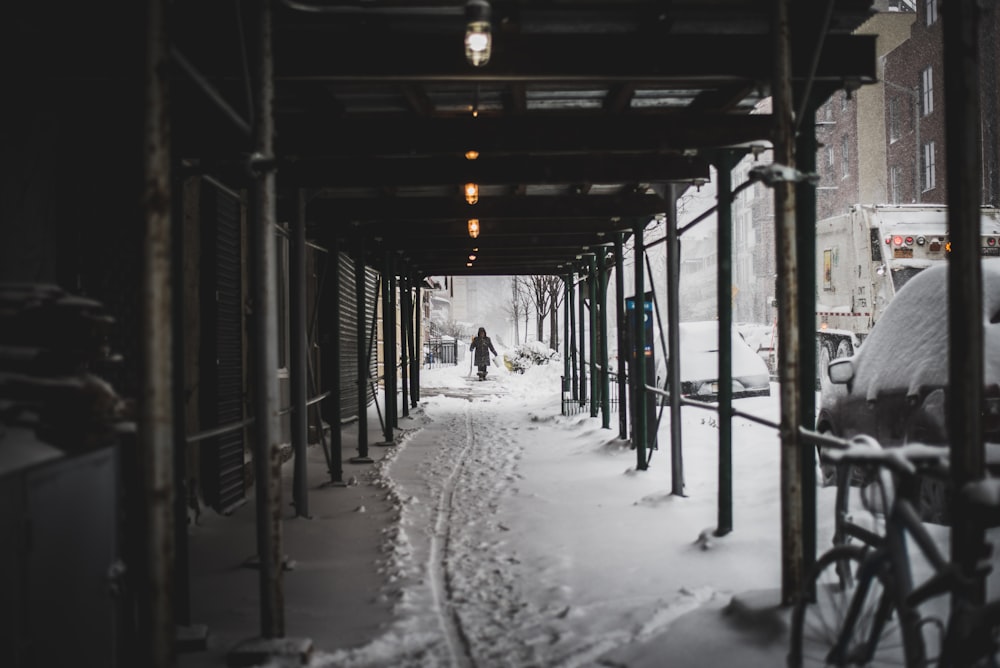 person walking on hallway covered in snow