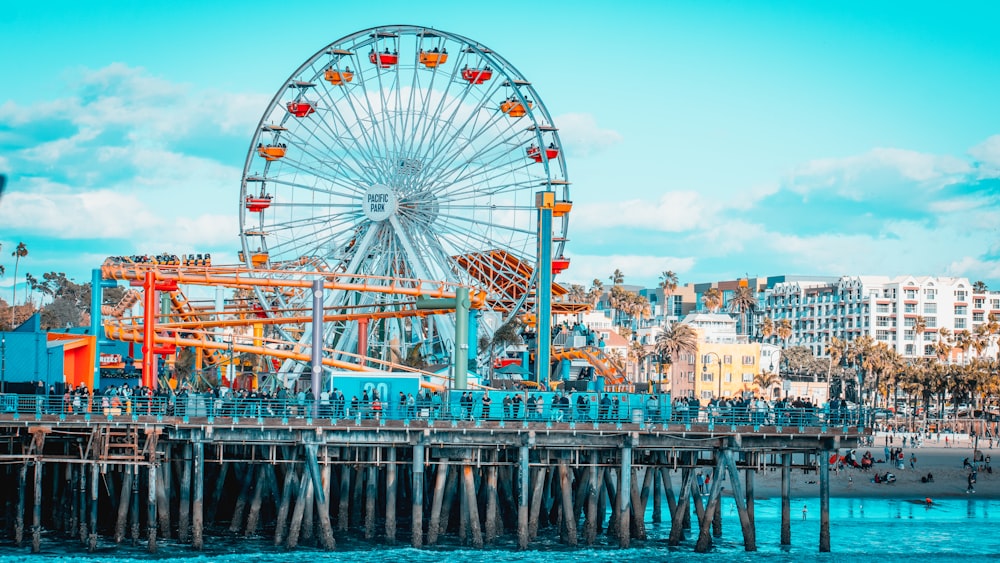 blue Ferris wheel across buildings