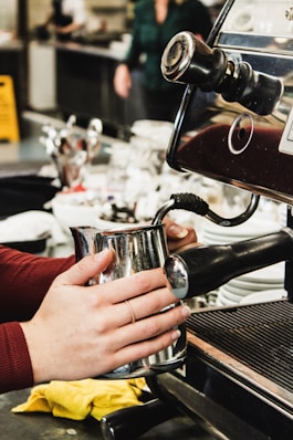person making coffee
