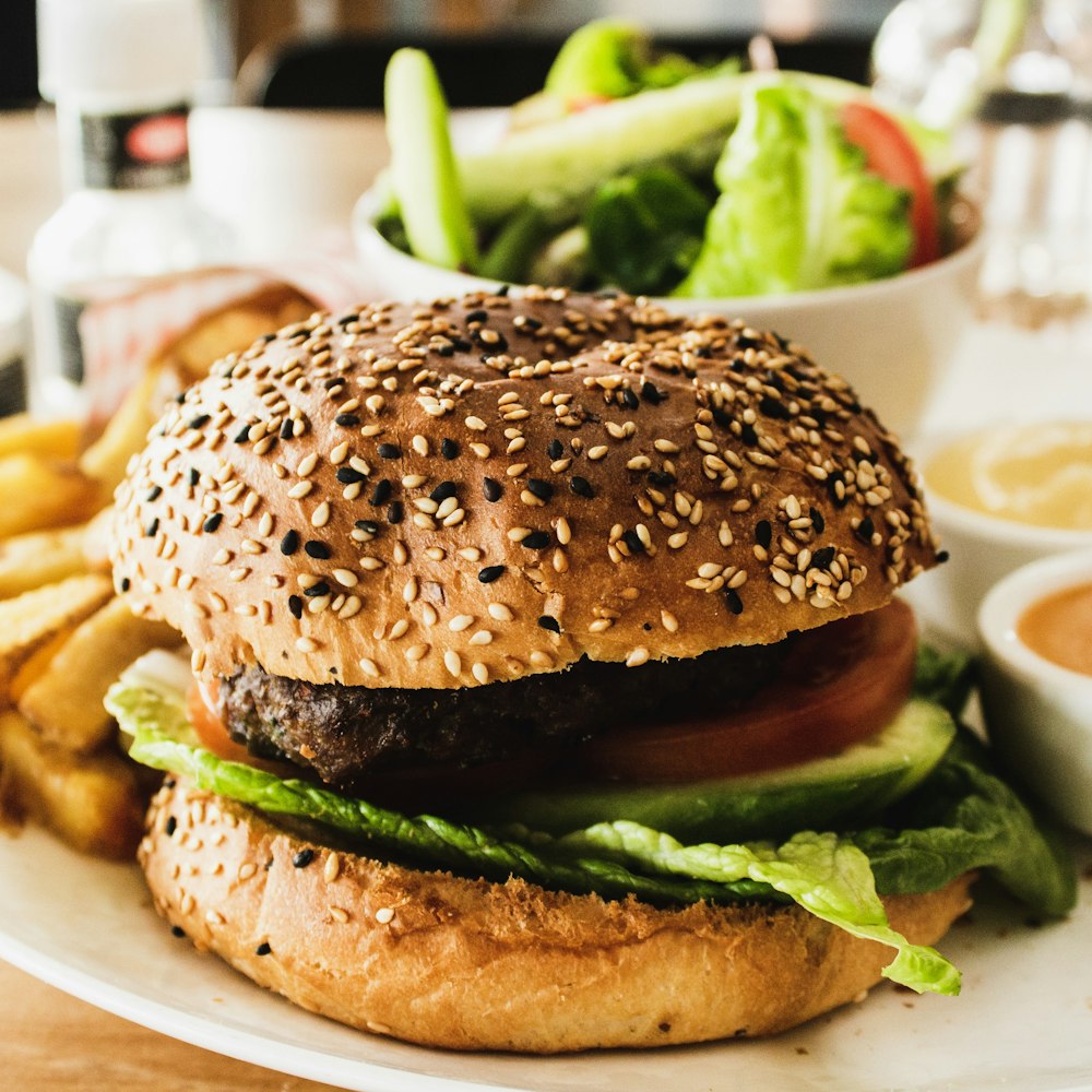 burger with tomato, lettuce, and fries