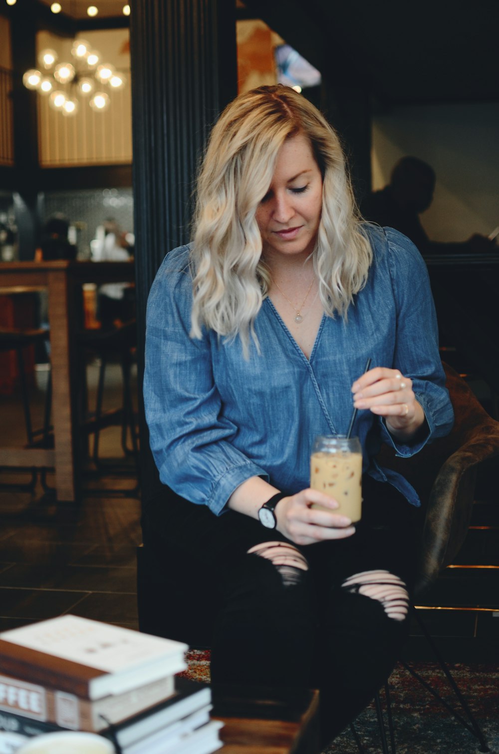 woman holding gray can