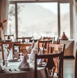 brown wooden dining set inside room