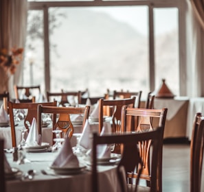 brown wooden dining set inside room