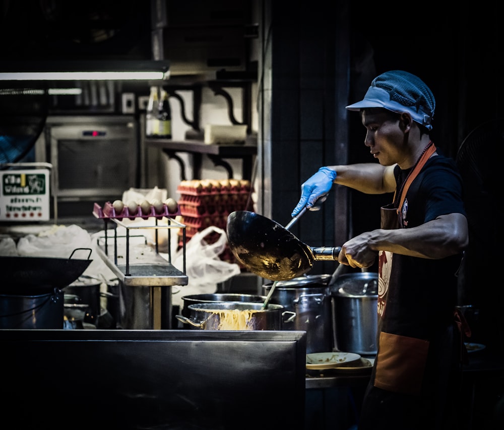 man cooking in kitchen