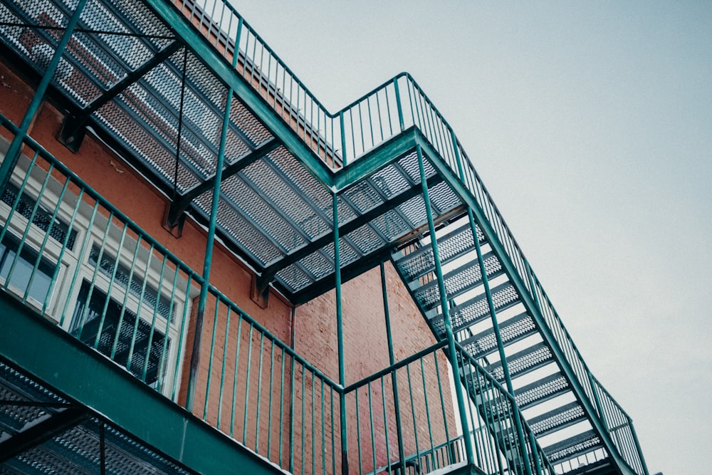 green and brown concrete building low-angle photography