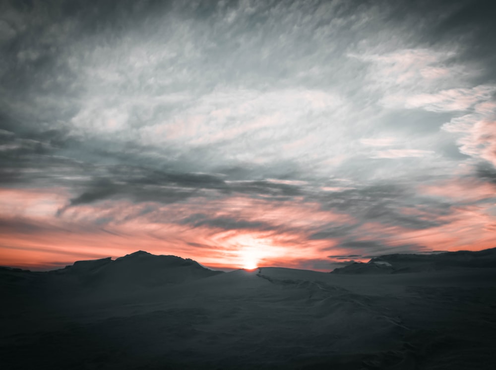 gray rocky mountain during sunset