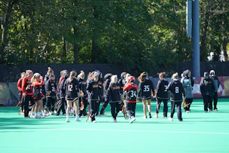 Young athletes practicing teamwork on a sunny outdoor field in Pontiac.