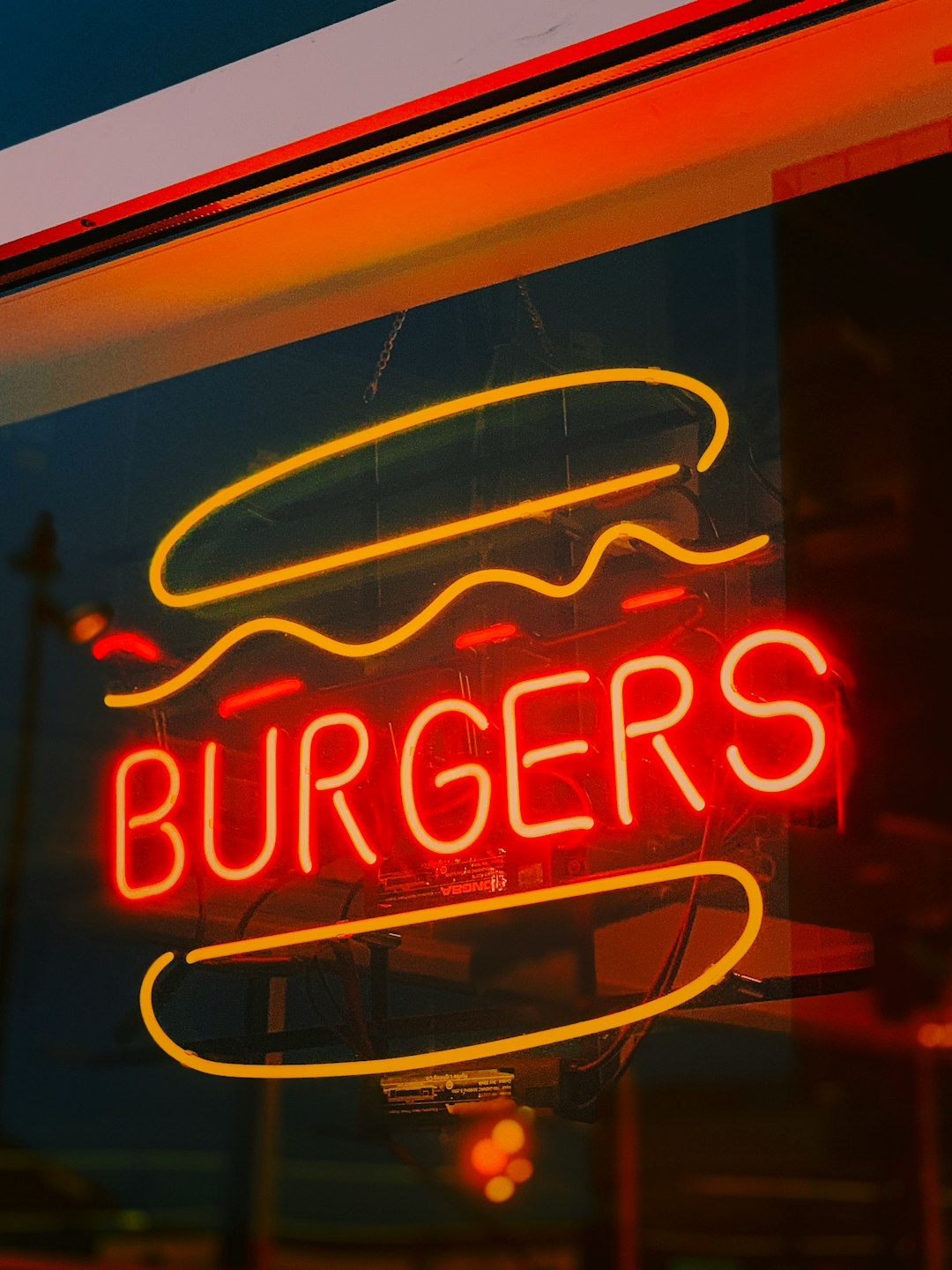 red and yellow Burgers neon sign