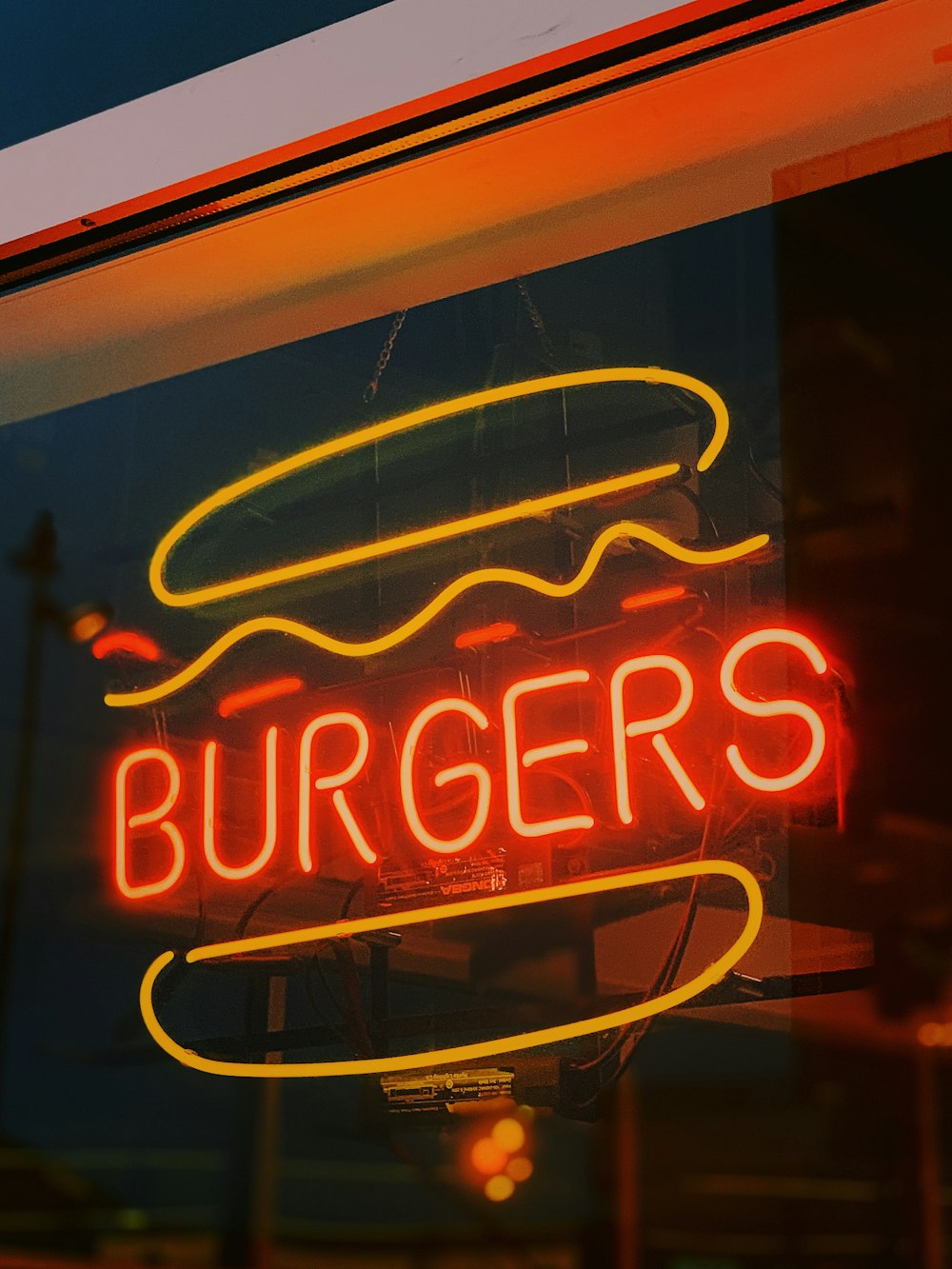 red and yellow Burgers neon sign
