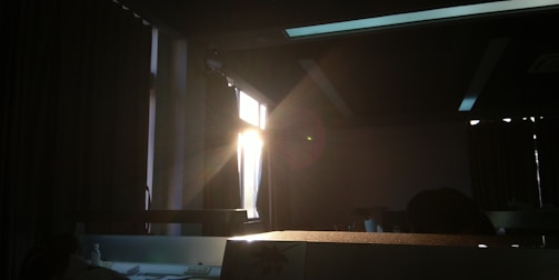 Close-up of natural light streaming through a window into a cozy interior.