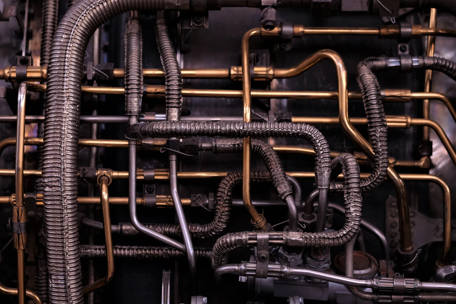 Brass-coloured and black pipes in a row