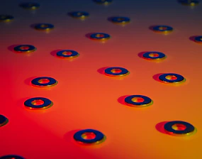 Close-up of shiny PEEK washers stacked neatly on a workshop table