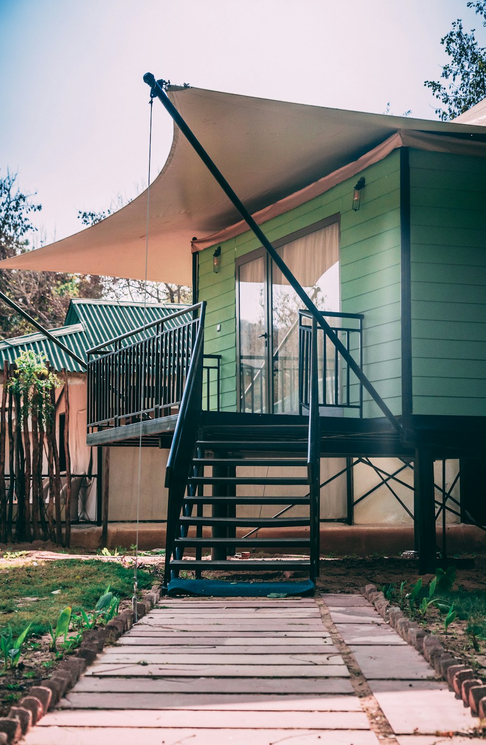 green wooden house