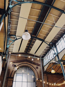 Bright showroom interior featuring steel beams and open space.