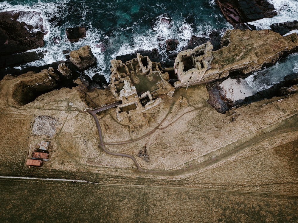 aerial photography of ruins by cliff