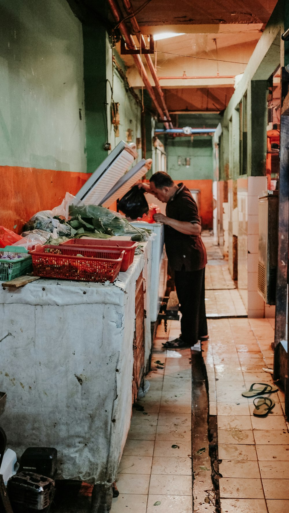 man looking inside deep freezer