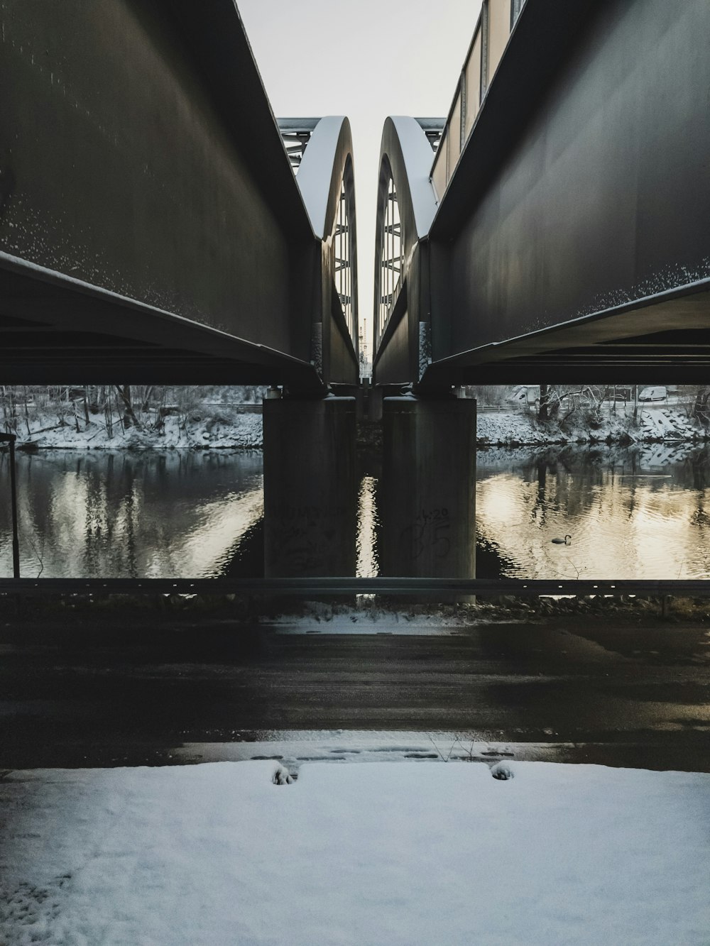 river under bridge at daytime