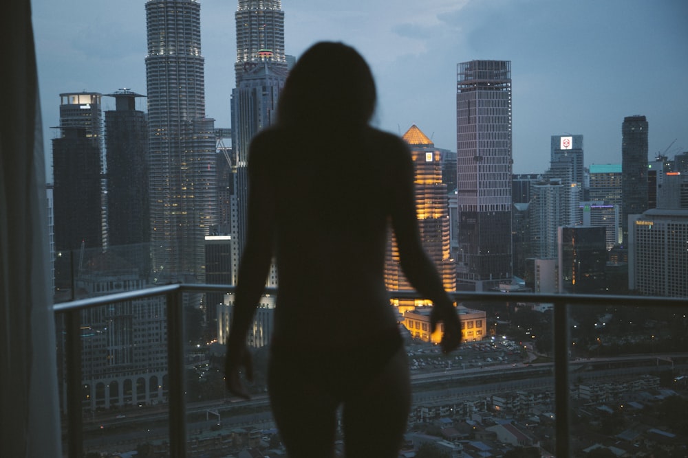 aerial view of a city and a naked woman