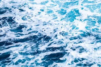 body of water with foams