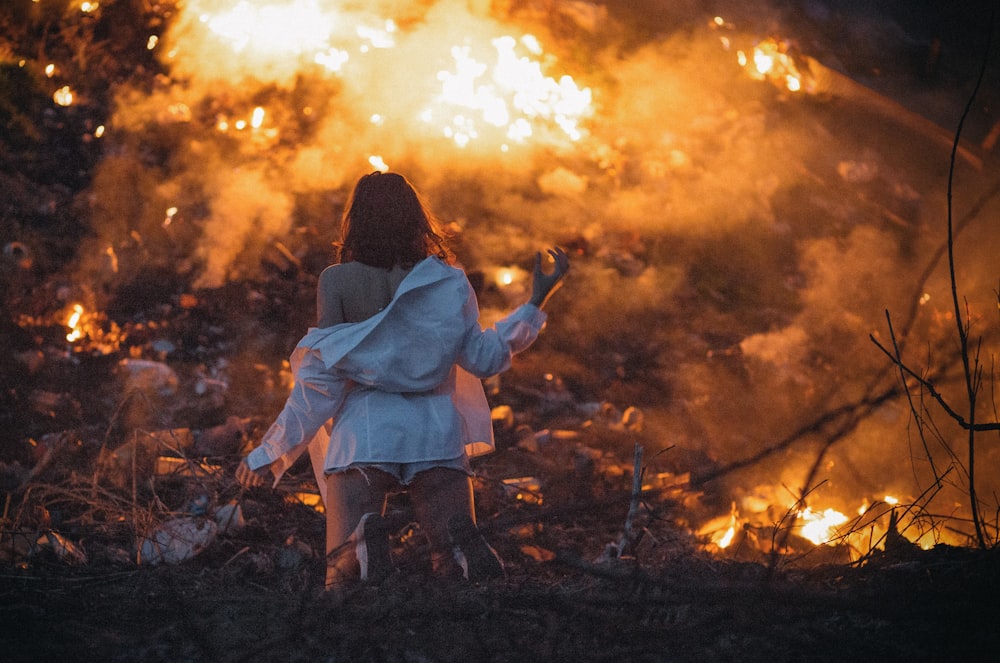 woman wearing white dress shirt standing near ember